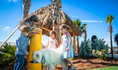 4 kids and a dog at a water fountain inside Cabana Club RV Resort in Auburndale FL