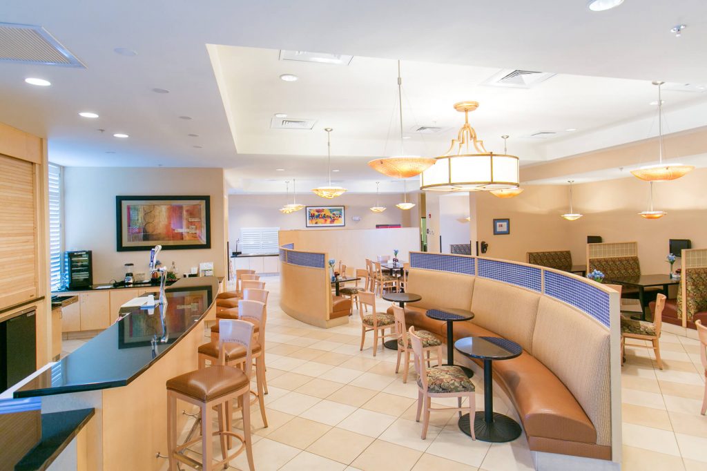 Dining, bar and sitting area inside Holiday Inn Winter Haven