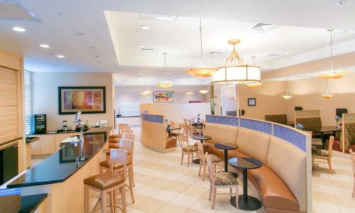 Dining, bar and sitting area inside Holiday Inn Winter Haven
