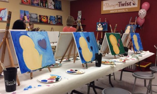Participant paintings on table during class at Painting with a Twist in Winter Haven, FL
