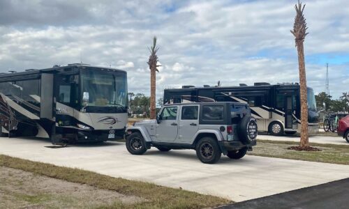 2 motorhomes and personal vehicles parked in oversized RV sites at Resort at Canopy Oaks in Lake Wales FL