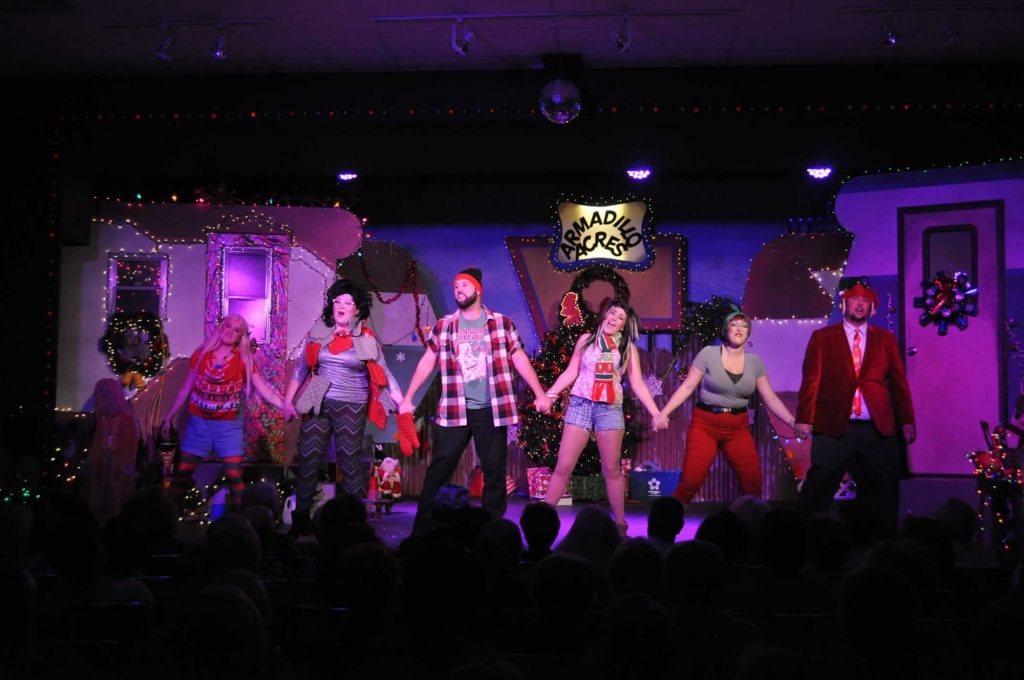 Actors on stage during Christmas themed performance at TheatreWorks Florida in Davenport.