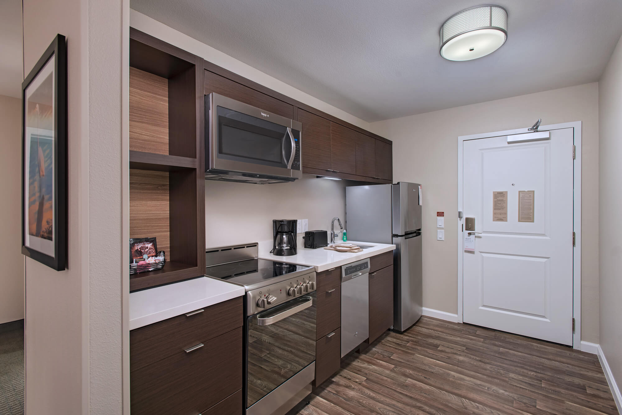Kitchen area of suite at TownePlace Suites Lakeland