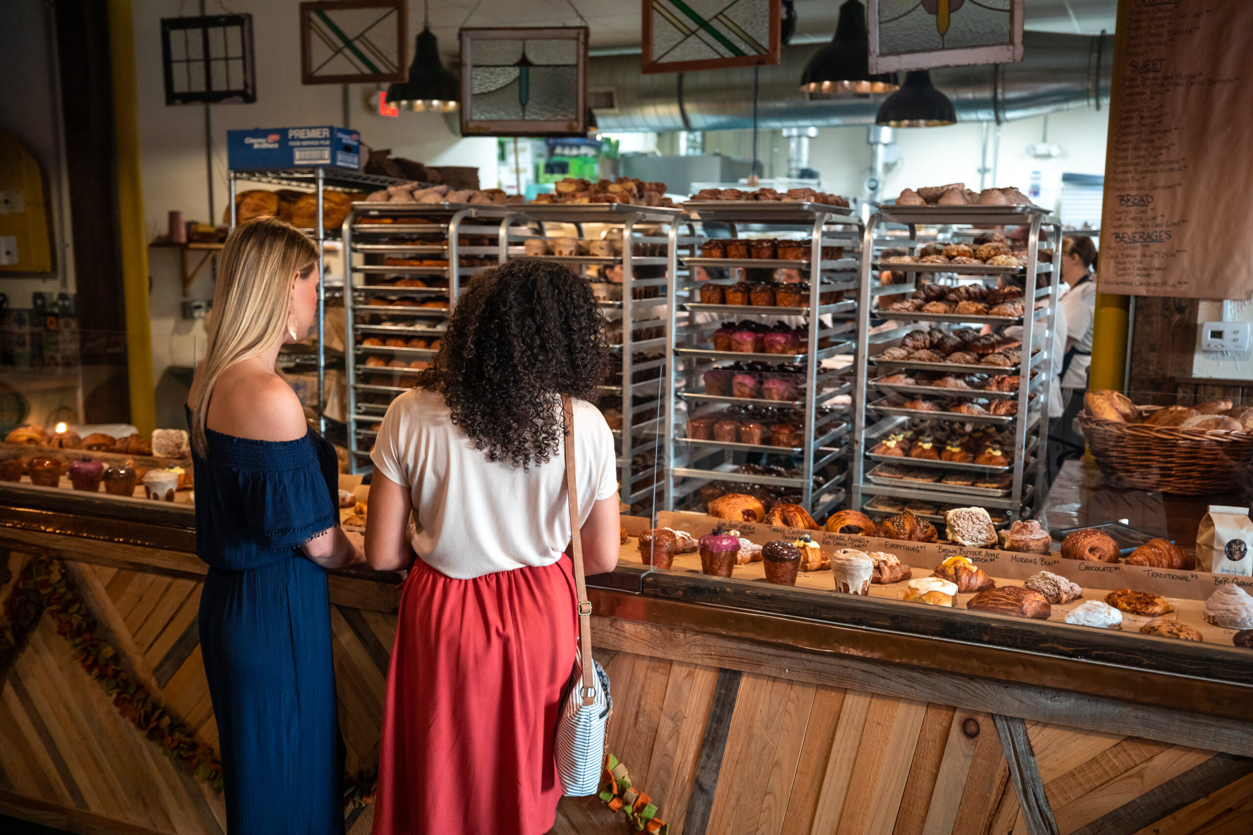 Two girls ordering at Born and Bread Bakehouse during their weekend in Lakeland