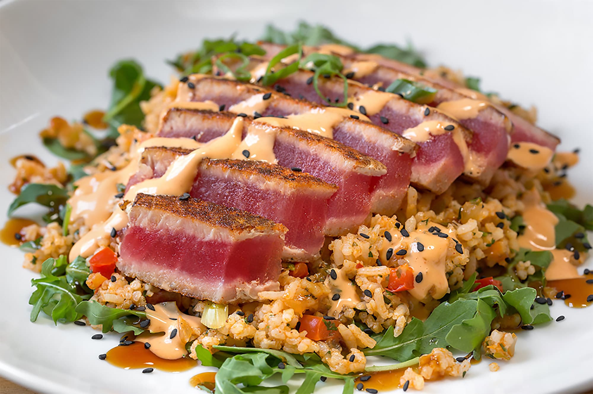 blackened tuna over rice at Harry's Seafood Bar and Grille in Lakeland, FL