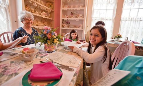Young girl having lunch with grandma and siblings at Lavender N Lace Tea Room in Lake Alfred, FL