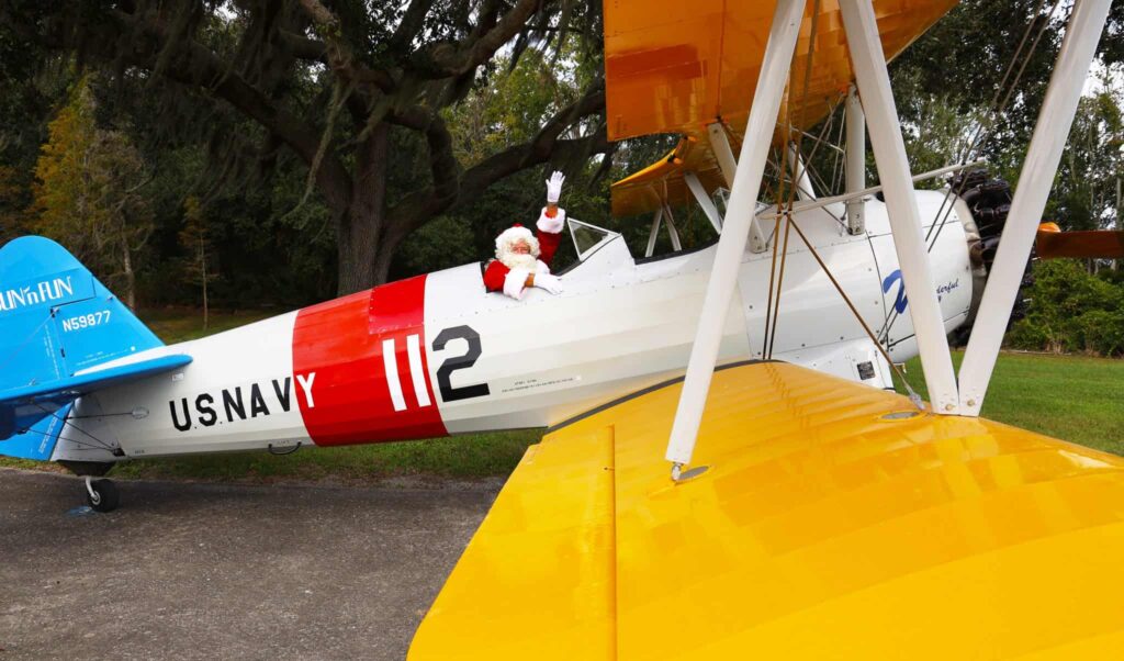 Santa sitting in an airplane at the SUN 'n FUN flying festival