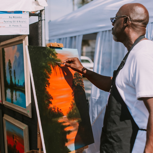 Man painting at the Lake Wales arts festival