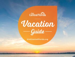 top half of VCF vacation guide cover showing title, logo with sunset in background