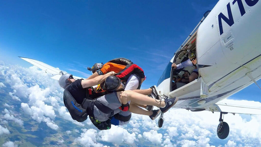 3 jumpers coming out of plane, mid air, at Jump Florida Skydive in Lake Wales, FL