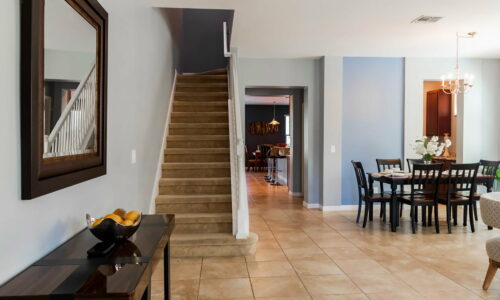 entryway stairs, and dining area of home managed by JC Vacation Homes