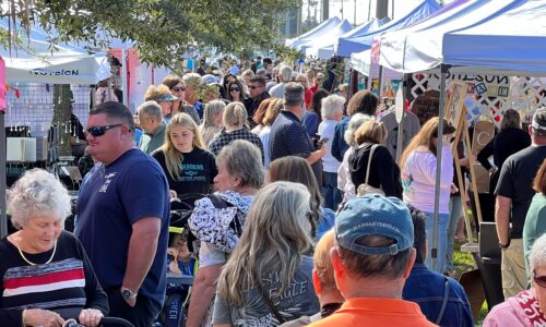 People gathering at the Haven Holiday Market in Winter haven
