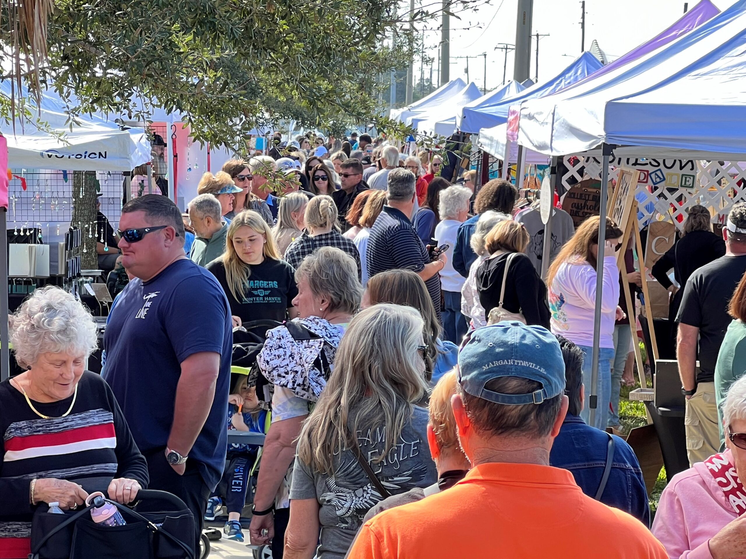 People gathering at the Haven Holiday Market in Winter haven