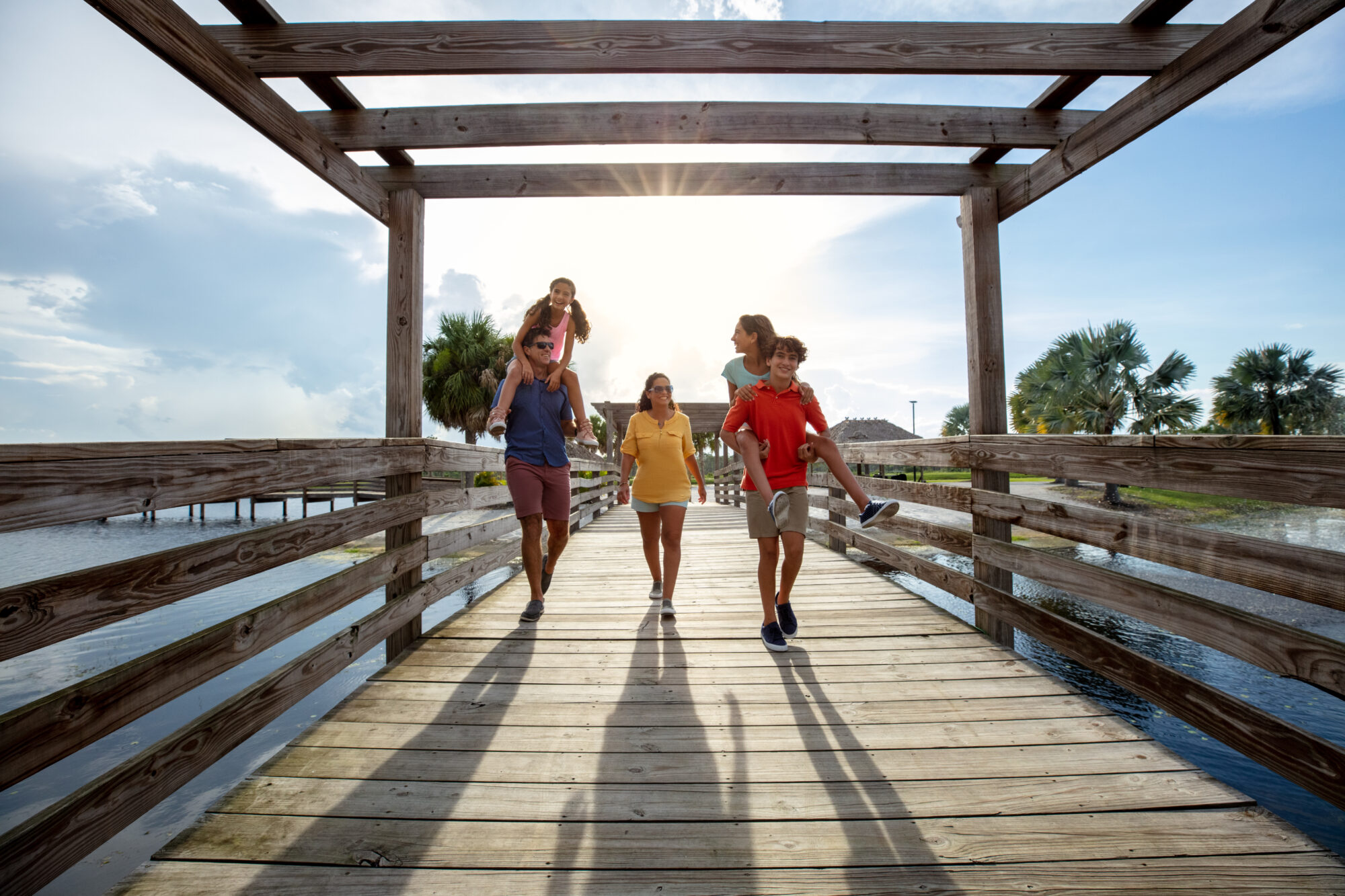 Family walking on a dock at Canopy Oaks