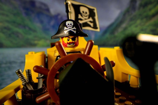 LEGO® pirate captain steering the ship