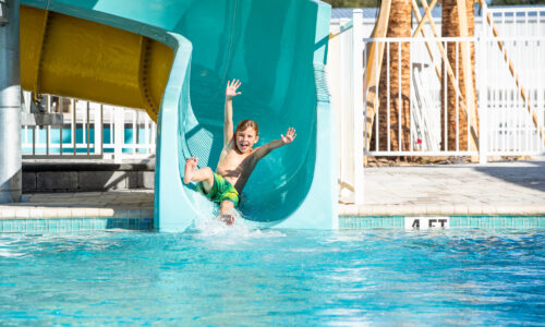 Boy on water slide