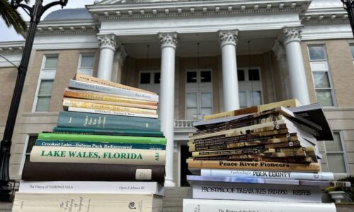 Books stacked outside Polk History Center