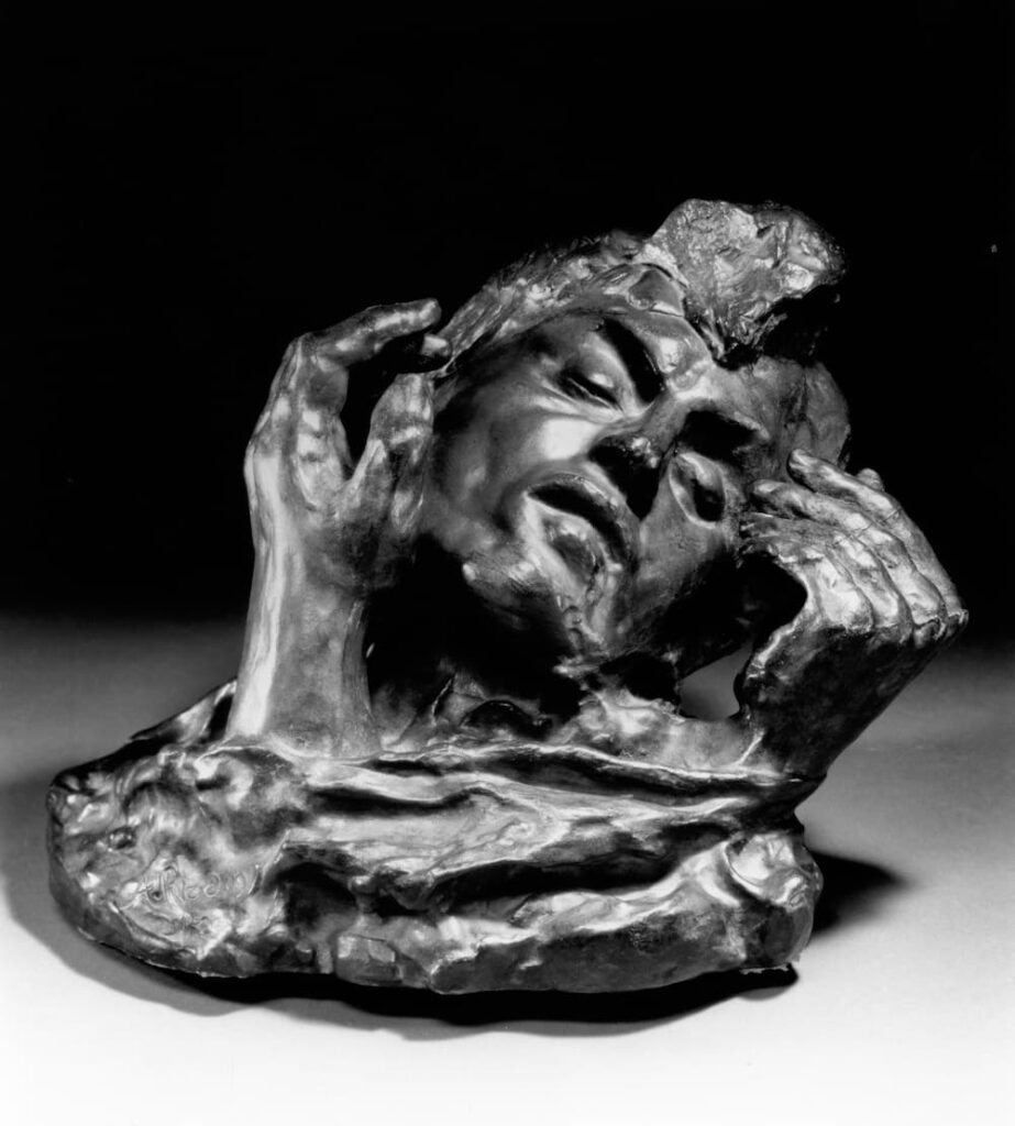 Rodin Exhibition sculpture of a head with two hands