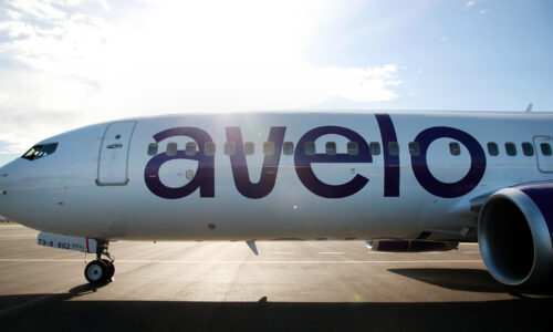 Avelo plane sitting on the tarmac at the airport.