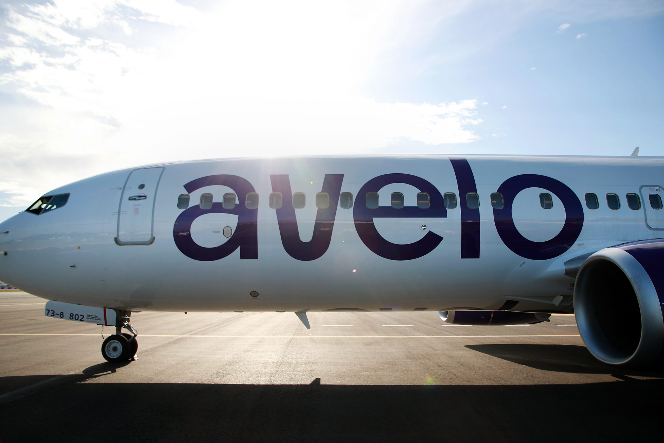 Avelo plane sitting on the tarmac at the airport.